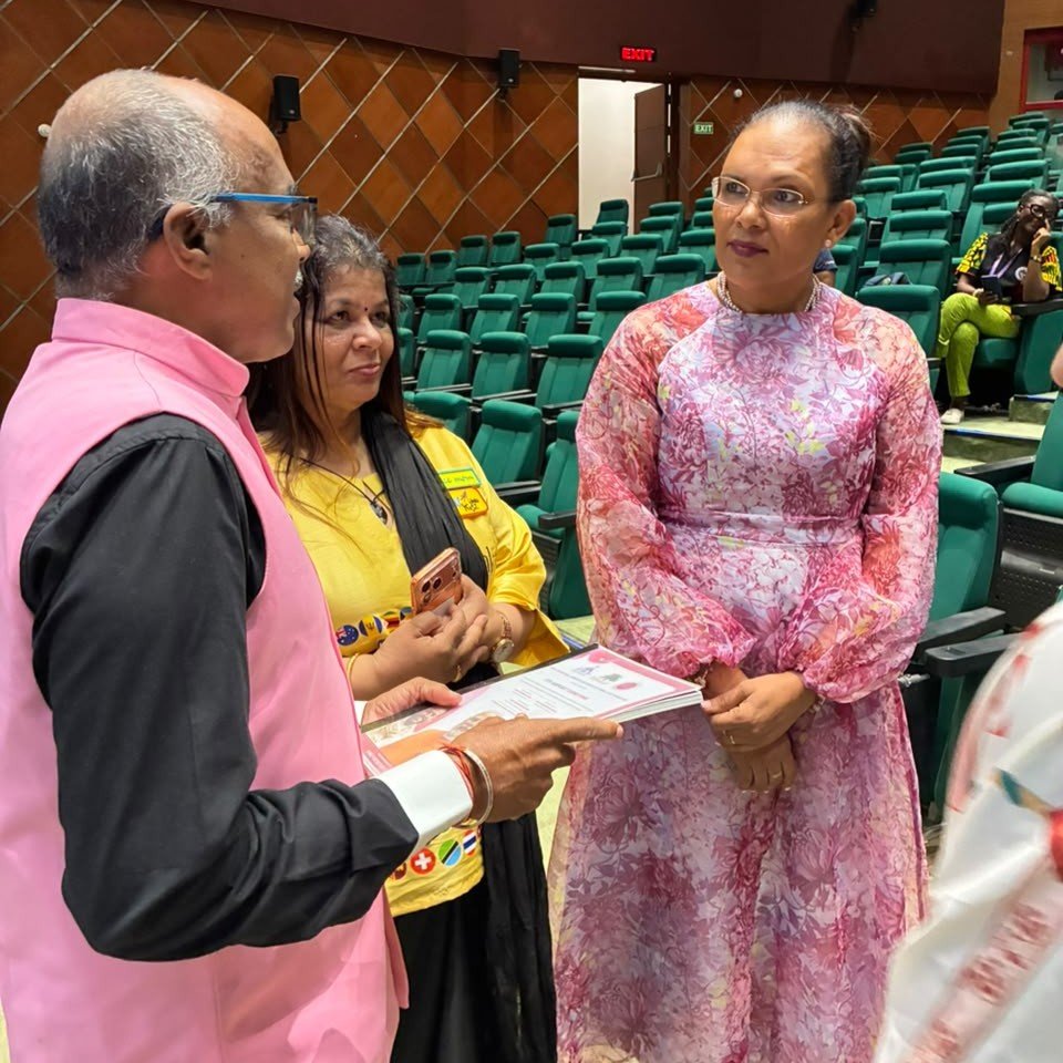 India Turns Pink representatives in discussion during a Seychelles interaction